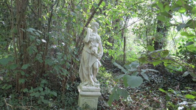 Statue in trees.