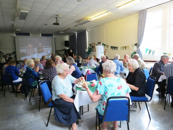 More guests enjoying tea