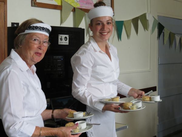 Two waitresses, working.