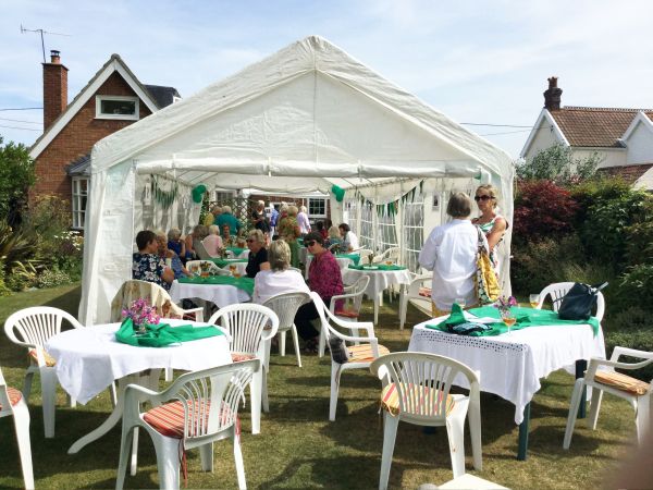 Pimms, Raffle and a Quiz in President Pat Swindell's garden. View of marquee and members.